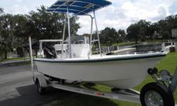 1999 Angler 18? with a 2008 60hp Suzuki four stroke engine with 90 hours. Poling platform, 2009 T-top with rocket launchers, stainless propeller, trim tabs, 500 pound capacity self-bailing hull, and a 2009 Magic tilt trailer. This boat is pristine.