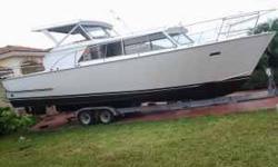 Here is a 32 all aluminium boat from marinett year 1971 with newly rebuild engines with and trnsmitions 2 318 Chrysler with almost zero hours new paint and interior it has a lot of space for family and fishing call me with any question. It's a great