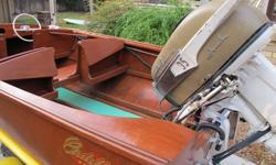 1957 Cadillac Marine and Boat Company runabout, a very rare and beautiful mahogany wooden hull boat. This is a cold molded wooden boat with 1957 Johnson 35 hp motor restored in 2008. Boat had new varnish in 2009 and includes a period correct trailer.