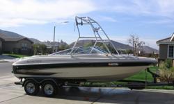 2001 Glastron GX205 Ski/Runabout/Bowrider - 20", 5.0L Volvo Penta I/O with low hours, electronic trim, v-hull, ski tower, xenon tower lights, tower speakers, tower board racks, 1k watt amplifier, (2) 12" inch subs, cd player, two battery terminals, (2)