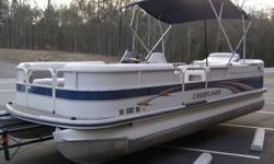 This 2005 Crestliner 2285 Pontoon has an L-lounge with table, forward sofas with another table, and a premium helm station, entertainment center, cooler, sink and a nice captain?s chair. MUST SEE.
