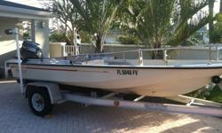 This is a 1986 Boston Whaler Super Sport. It has the continuous rail thru the full bow. It has been completely restored and is in mint condition. The engine is a 1989 Yamaha and runs like new, have maintenance receipts. the trailer is a 1999 Quick Load