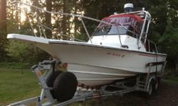Great NW Sport fishing boat, Boston Whaler combines decades of experience in center consoles and trailerable boats. Original gelcoat finish under the waterlineCustom Galvanized Load Rite Tandem Trailer with 2 spare wheelsBoat comes with great electronics,