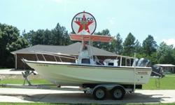 1994 Boston Whaler Outrage 21 foot with twin 115 Yamaha outboards with stainless props, Center console is still an absolutely amazing boat that is Very dependable and always fires right up and has been winterized and summerized every year. It has all the