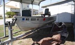 Complete set up 72 model Lowe aluminum boat, 6.0 Evinrude motor,large trolling motor,2 marine batteries,4 life vests, raised seat, center seat and all are covered in wood, no leaks or damage to hull. Tilt trailer,good tires and spare,gas tank. Water