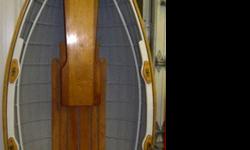 This beautiful little row boat tender has never been in the water. It was kept inside. It is brand new. Beautiful finish and details. Very elegant little boat. No oars. you can find oars all over ebay for 20 bucks. It is entirely made out of wood. 90.5"