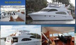 2003 Hatteras 63 RAISED PILOT HOUSE No Discipline is a 3 stateroom Hatteras Motor Yacht with Satin Cherry wood throughout a mid ship master. This yacht offers dual helms, a very spacious bridge with tender storage, a large salon with the galley