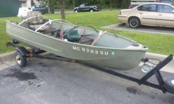 12ft v-bottom aluminum fishing or duck boat w/ 10hp johnson gas motor. It starts very easy and runs super good, u will not be disappointed on how easy and good this motor runs. Comes with 5 gal. Gas tank with gas gauge. This boat has built in marine
