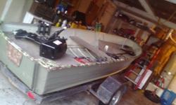 14 ft aluminum deep v boat back deck with bubble box live well. humming bird depth finder 2 large deep cycle batteries. 36lbs Minn Kota trolling motor. 10 horse johnson out board trailer 2 five gallon fuel tanks pole holders 2 wooden ores trailer new