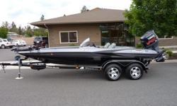 This 2002 Triton TR-20 Bass Boat is in excellent condition. It is powered by a Yamaha VMAX 225 3.1 L Motor with jack plate and comes with a Triton trailer and a Motorguide Tour Edition 109 7109V Trolling Motor. We have had the motor serviced and a