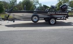 THIS 2008 BASS TRACKER PRO TEAM 175 30TH ANNIVERSARY BLACK AND SILVER BOAT WITH MATCHING TRAILER AND SPARE. THIS BOAT IS POWERED BY A 50HP MERCURY 2 STROKE OIL INJECTED MOTOR ( 20 hours ).INTERIOR: THIS BOAT IS AS CLEAN AS YOU WILL EVERY FIND ONE. ALL