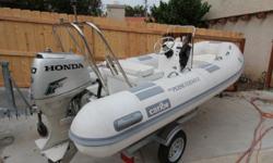 2008 Caribe C13 Inflatable RIB with 40 HP Honda 4-stroke Outboard. Steering console with cable steering, gauges, engine control and storage, custom stainless steel arch with ski bar, navigation light pole and fishing rod holders, flip-down upholstered