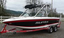This is a very sweet looking one owner fully loaded Supra boat! Very desirable black/red/white color combination. Upgraded 5.7 Indmar Assault with 340HP. 390 Hours on the meter. Spacious and comfortable interior with seating for 13 and lots of storage