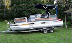 21 ft party barge with live well, 2006 75 hp Evinrude motor fuel injection with 20 gal fuel tank, new plugs and runs on100 to1 oil, always had premium fuel in it. Boats in pretty good shape for year. 306 867 XXXX or 306 855 4701This ad was posted with the