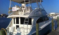 1998 Egg Harbor 52 There is an abundance of storage in the fly bridge. There is also very good access to the electronics box and the helm console. There is a canvas cover for the electronics, helm chair and cushion. 5? Ritchie compass, 12volt outlet,