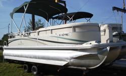 Very nice 2003 Bennington 2275 22' Tritoon for sale. This boat is in very good condition inside and out and it is loaded with comfort and performance features. It has a huge bimini top to give ample shade, Captain's helm chair, tilt wheel, full