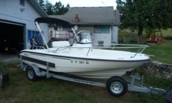 2005 Boston Whaler Dauntless 180 with 115 HP Mercury Saltwater Four Stroke Outboard Motor. Loaded! Everything works and Looks Like New. Comes with Bimini Top, New Humming Bird 385ci Fish/Depth finder and GPS combo, Bait well, cooler/ice chest, all seat