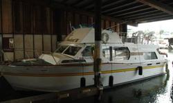 37 foot cabin cruiser offered for sale. Lying Seattle Ship Canal, east of the Locks in gated, covered moorage (not included in price). A very nice well-maintained liveaboard. Roomy below with large upper deck/flybridge. Nice galley, two heads. Twin
