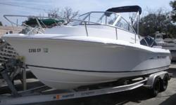 This is no doubt a very clean Sea Hunt walkaround cuddy cabin powered by a 2007 Yamaha 150HP four stroke outboard. 2008 Magic Tilt Aluminum trailer included.
