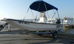 2001 Carolina Skiff J-16 center console with her 2007 Yamaha four stroke 20 HP outboard and Performance galvanized trailer. I bought this boat not too long ago to use as a small island hopper/night fishing skiff but recently had the oppurtunity to