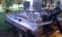 Great little Pontoon fishing Boat in Excellent condition. 6'5' wide 12'8" long. It has Aluminum pontoons.2 trolling motors front and back, depth finder, Trailer. $2600. 4hp mercury motor in picture is available for $500 extra. Must see. Call for more