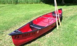 It's 17' 9" long. 2 seater. There are no patches, no dents, and no major scratches. It does have a few minor scratches on the bottom like any other used canoe does. New red paint on the outside. Not been in water since new paint. Current registration good