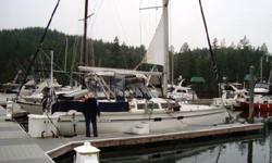 This boat is center cockpit and out-fitted for offshore use. Production started in 1990 for this series, it is a sloop, furling genoa and main sail, bulb-wing keel and has a Yanmar diesel engine and Kubota generator. Interior offers teak and holly sole,