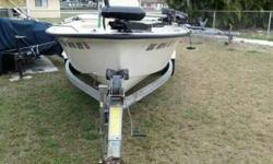 1990 17.2 ft Key west sportsman center console boat with a 90 hp johnson motor (140 compression in all cylinders) stainless steel prop,motor runs great,compass,three batteries with switches and charger,trolling motor,fish finder,never bottom