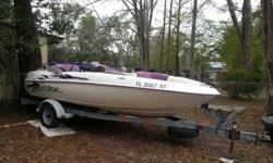 1998 yamaha exciter with trailer. has binimi top and boat cover. seats 5---very fast-twin motors