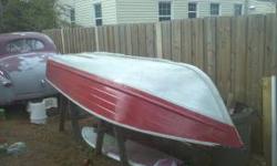 12 foot red aluminum Montgomery Ward. The boat is in good condition, no leaks, cracks, etc. Can be used for rowing or equipped with a motor. The boat has a homemade trailer that it comes with. I love the boat, just don't have time for it anymore. Contact