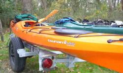 Wilderness Systems Tsunami Sea Kayaks-Aquabound glass paddles and PFDs. Orange is 14.5 Green is 14. 575.00 each or both for 1000 for a quick sale.Located on St Simons near Bwk Ga. 912 634 6076 no emails
