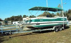 This deck boat, with a 150 hp Evinrude motor and aluminum trailer, is READY TO GO! The boat is in EXCELLENT CONDITION! All upholstery was redone less than one year ago, it has 2 bimini tops, salon enclosures, and a transom live well. Includes trailer with