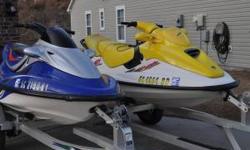I have 2 jets skies one is a 1997 yellow bombardier GTI 3 seater with reverse and the other is a 2001 blue Kawasaki 2 seater it does not have resverse. The trailer is 2007 triton brought brand new. The
back seat is tore on the yellow ski as you can see on