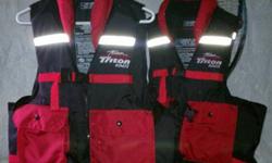 Set of two Triton Boats Black and Red Life Vests. Worth $69 a piece. Like new Condition. Priced to sell. Will ship if needed for extra.