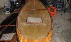 Beautiful cedar stripped canoe. 10 foot long. This is a lightweight canoe, 17 pounds. Constructed from 1/8 inch cedar covered on the exterior with 4oz fiberglass overlapped on the bottom. The interior is 6oz Kevlar. The boat is bullet proof!! The boat has