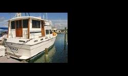 "Yolo" (You Only Live Once) is a one owner yacht which has been lovingly cared for since her first launch. This 44' Motor Yacht differs from the 44 Wide Body in that she has side decks surrounding the fully enclosed afterdeck making it much easier for two
