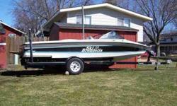 White with black and green trim. 5.8 Ford H.O. Inboard. Direct Drive. 860 hrs. Fiberglass Hull. Interior is in Mint Condition - always covered, has new cover. AM/FM, Rear Deck, Wake Board Pole, Ropes, Skis, Lifejackets. Everything you need to hit the