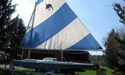 This is a like a Sunfish Sailboat on steroids!! Longer, deeper and wider than a Sunfish but has the simplicity. Price includes trailer. If you do not want the trailer the price $650.
