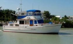 The Marine Trader 44 is a spacious trawler designed for comfortable cruising. She comes with flybridge with full enclosure, sun deck, cockpit, a roomy salon, and two staterooms. There's space for everyone and everything. Looking for a live-aboard, this
