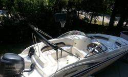 Like New 2006 Hurricane 237 Deck Boat, White With Black Accents, Yamaha 250 Four Stroke with only 130 hrs. Fully Loaded and Lots of Extras. VHF Marine Radio, Garmin GPS, Am/Fm Stereo with cd player, Bimini Top, Head, Trailer and all the gear you need to